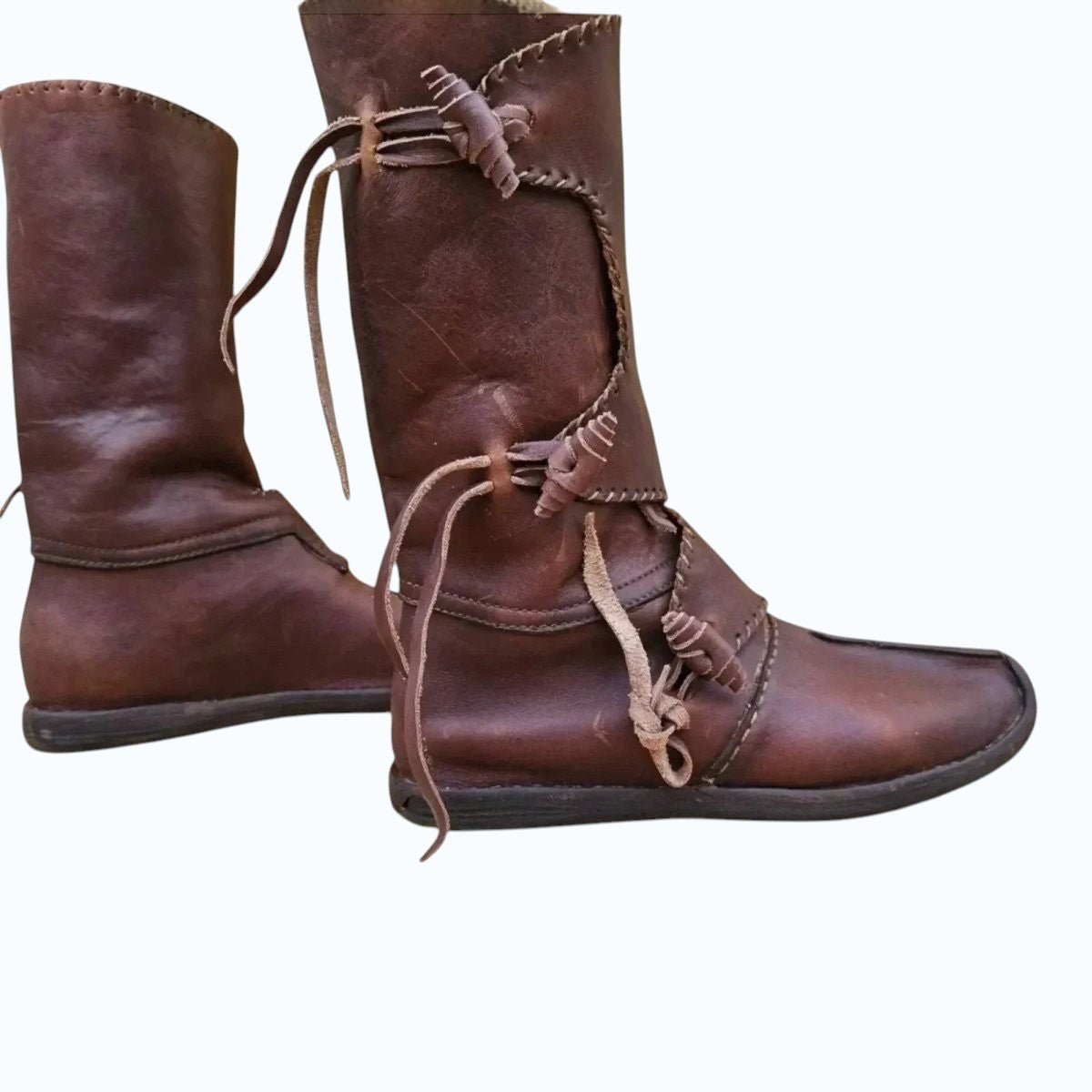 AtlasMuseCrafts handmade brown full-grain leather Viking boots with tie closures and decorative stitching. Medieval and Renaissance style.