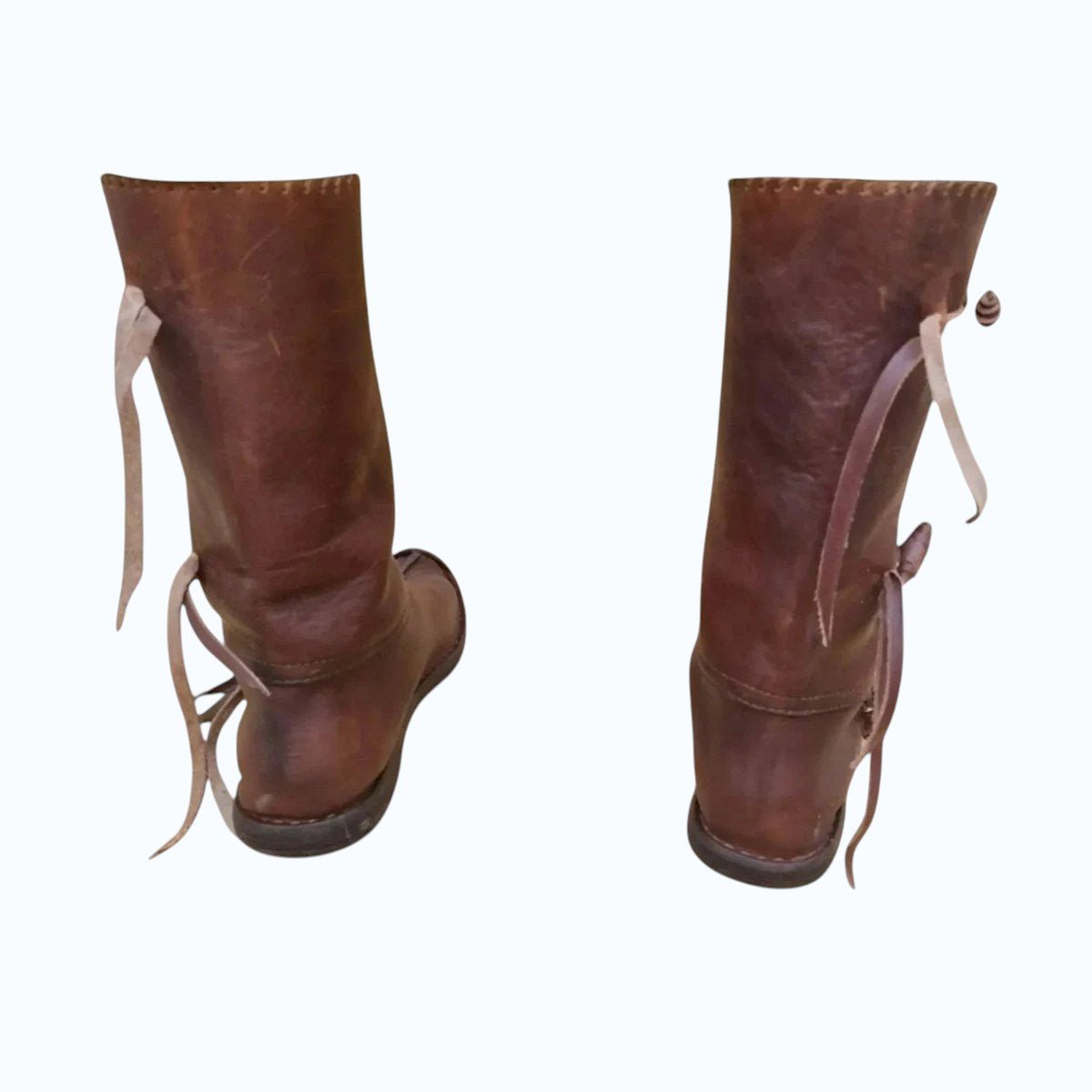 AtlasMuseCrafts handmade brown full-grain leather Viking boots with tie closures, ideal for LARP and Renaissance events.