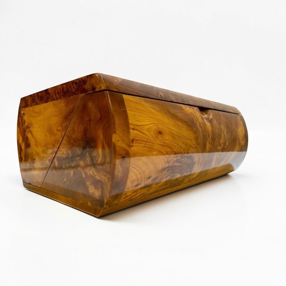 Handmade wooden jewelry box with curved lid, brass lock, and Thuya burl grain