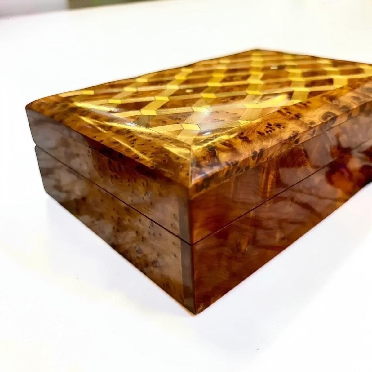 AtlasMuseCrafts ladies wooden jewelry box made from Thuya burl wood with inlaid geometric pattern on lid. Interior storage for rings, earrings, and necklaces.