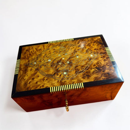 Thuya burl wood jewelry box with brass key lock and Moroccan inlay detail