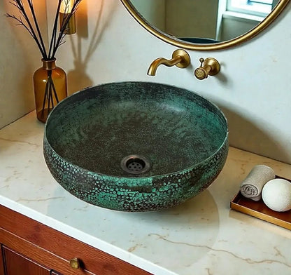 AtlasMuseCrafts green patina copper vessel sink with hammered texture, ideal for luxury bathrooms.