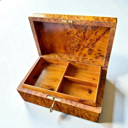 Open luxury wooden box organizer with interior compartments and brass latch