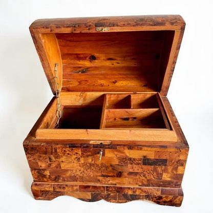 AtlasMuseCrafts handmade Thuya burl wooden box with coffer-style lid, brass lock, and interior compartments. Features unique burl grain patterns and warm wood tones.