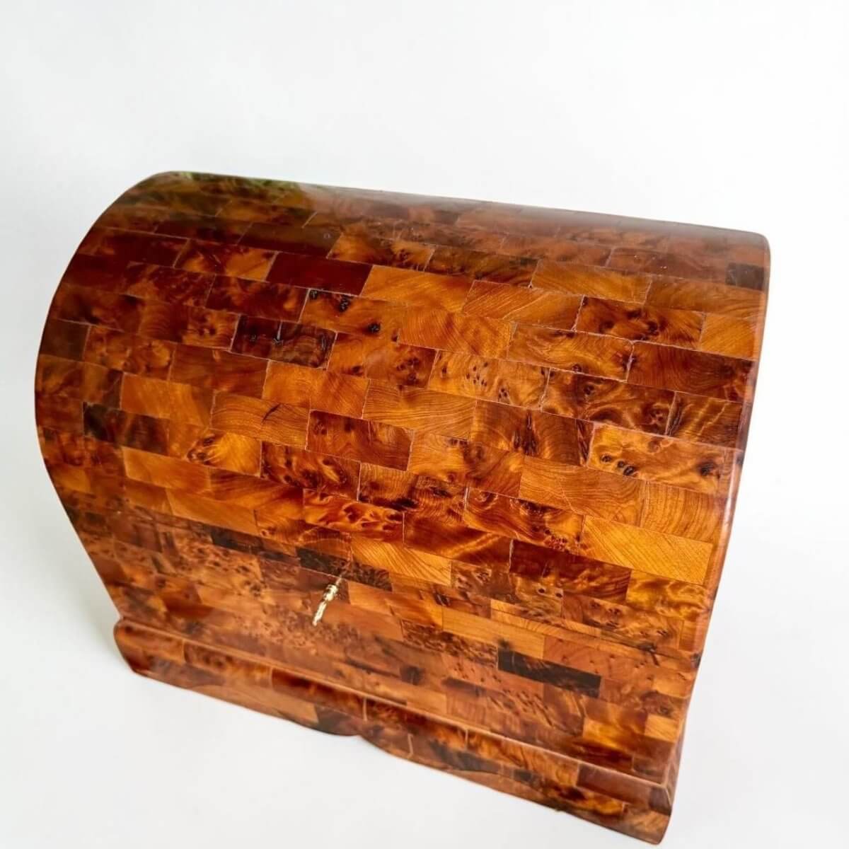 AtlasMuseCrafts handmade Thuya burl wood coffer-style chest with brass lock and intricate wood grain patterns.