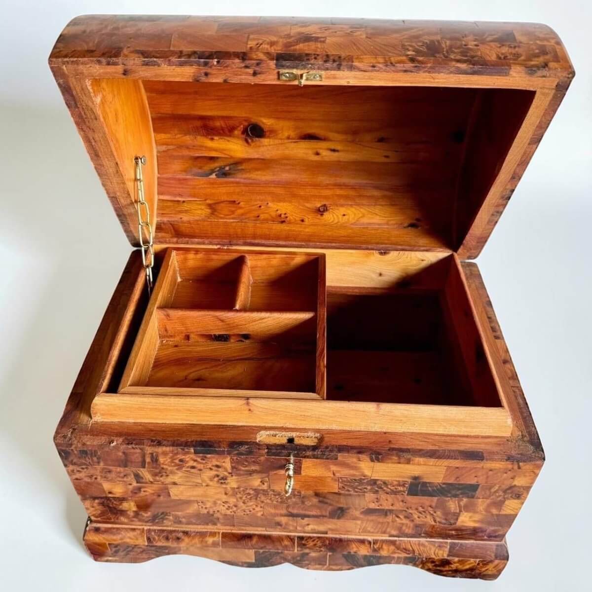 AtlasMuseCrafts handmade Mexican wooden box crafted from Thuya burl wood with a coffer-style lid and brass lock. Features interior compartments and a natural wood finish.
