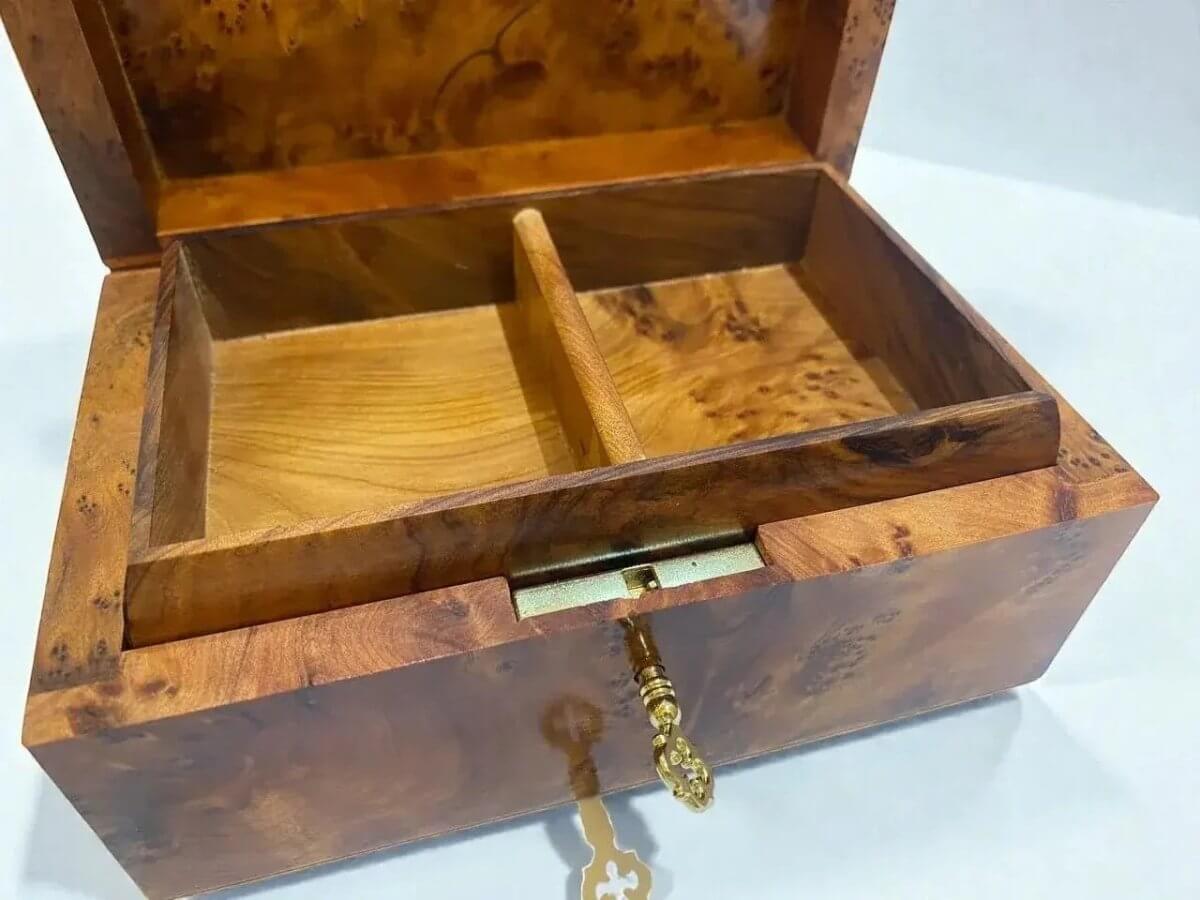 Inside view of wooden jewelry organizer – Moroccan Thuya Burl, showcasing handcrafted compartments and rich wood grain.