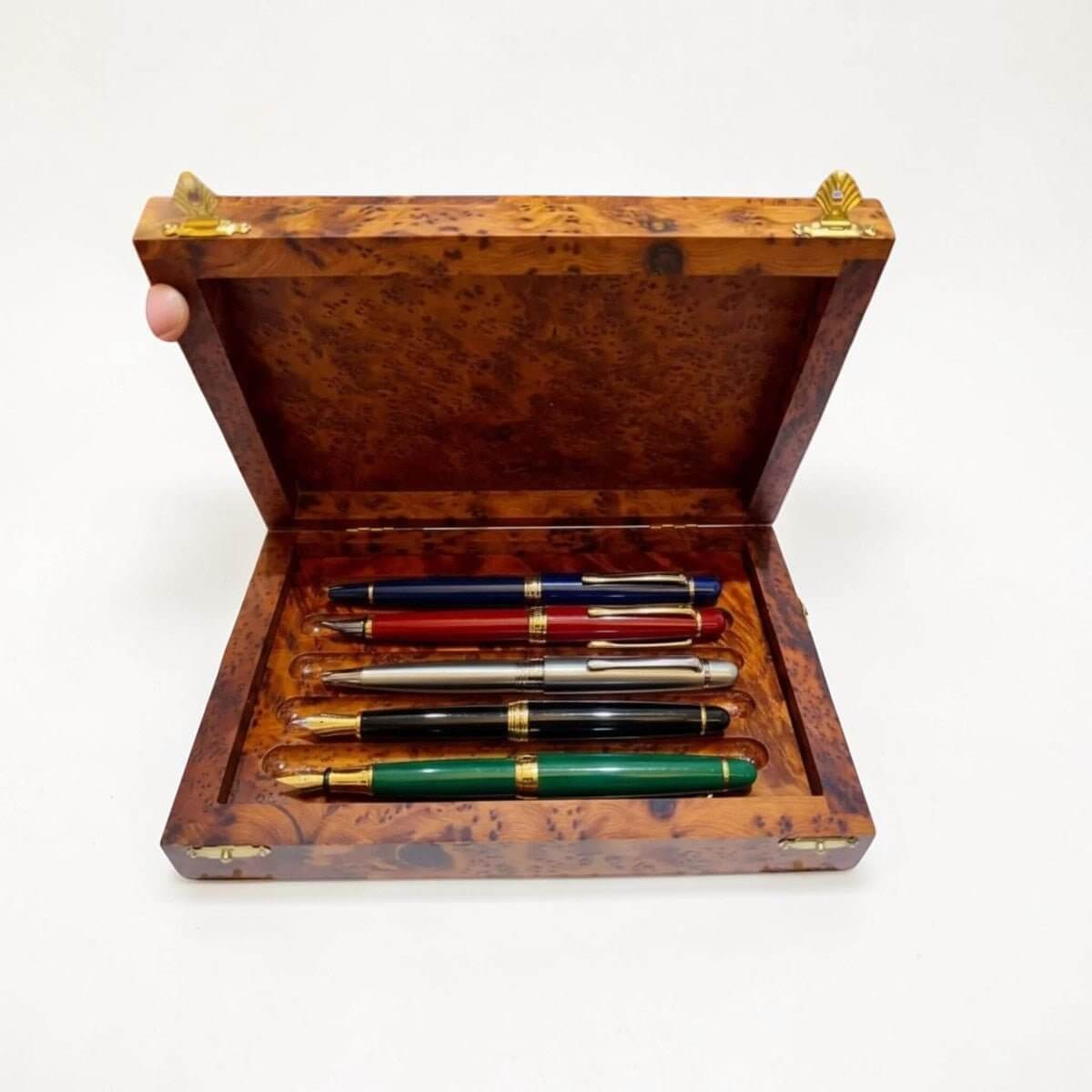 Thuya wood pencil case handmade in Morocco with pens and polished burl grain