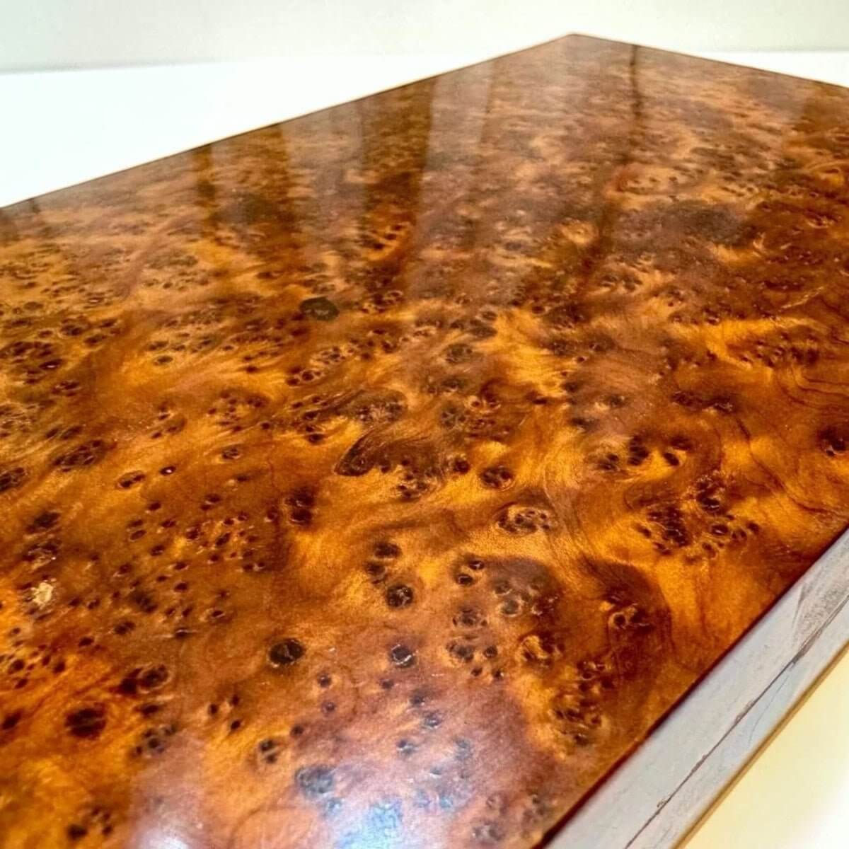 Moroccan Thuya wooden pencil case showing warm amber burl grain and smooth finish