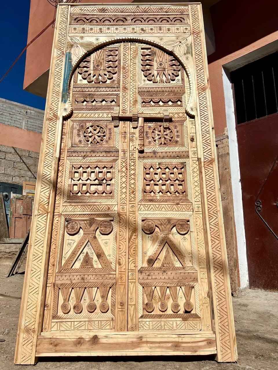 Custom Amazigh wooden door — full installed view