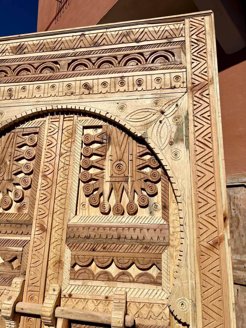 Atlas-region carved wooden door with brass option