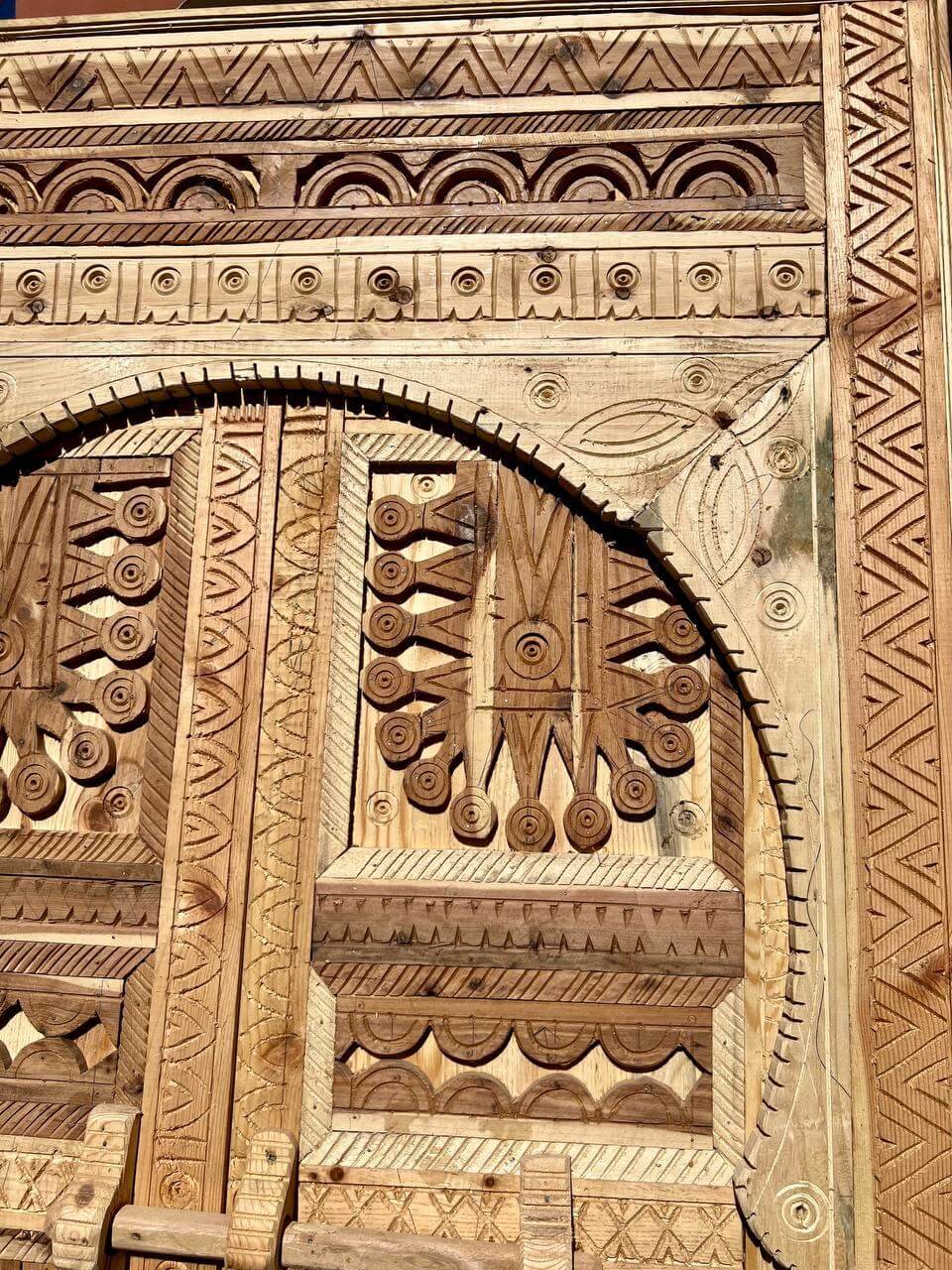 Hand-carved Amazigh entry door with traditional motifs