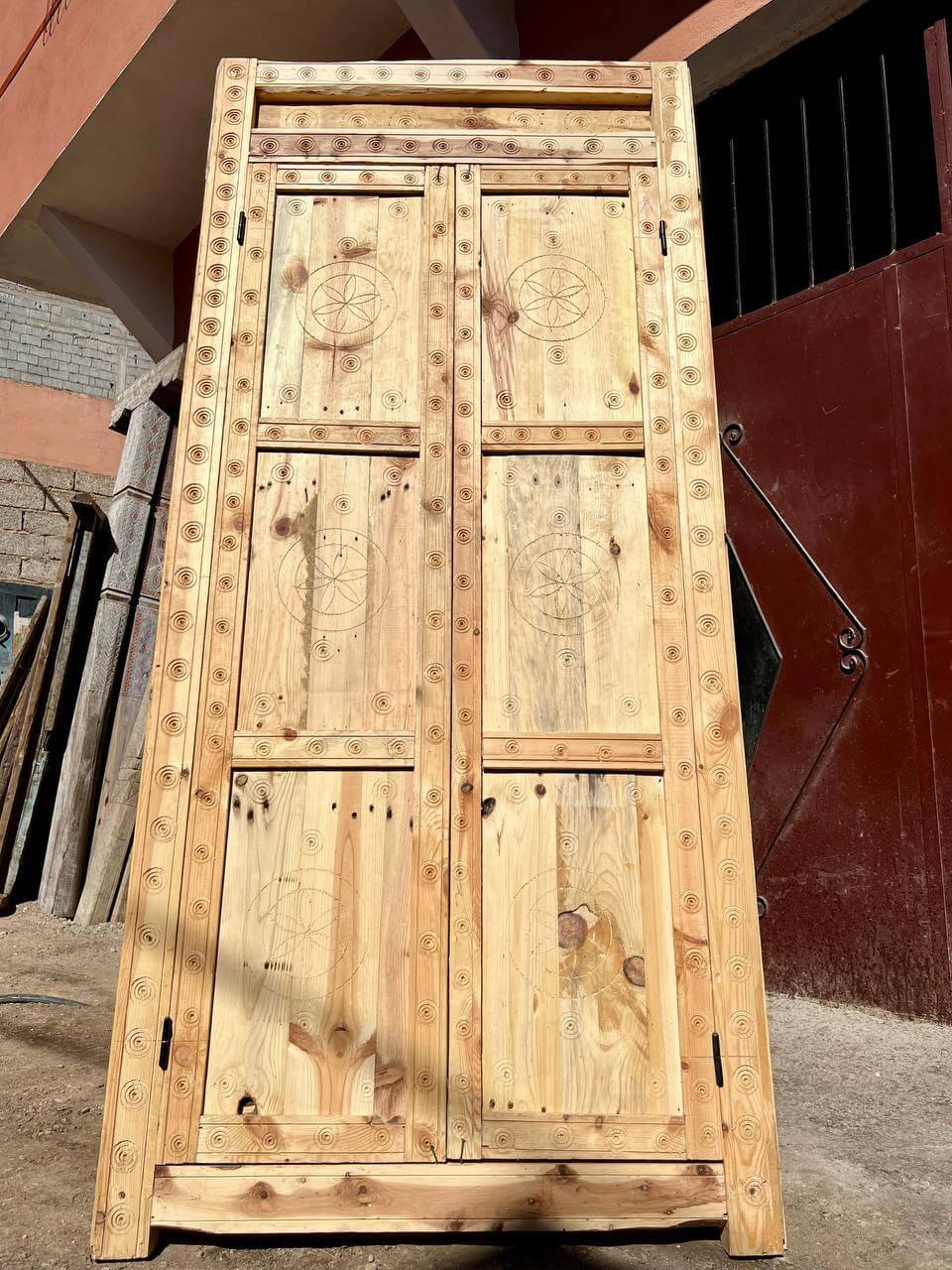 Tribal carved natural wood door for vacation rentals
