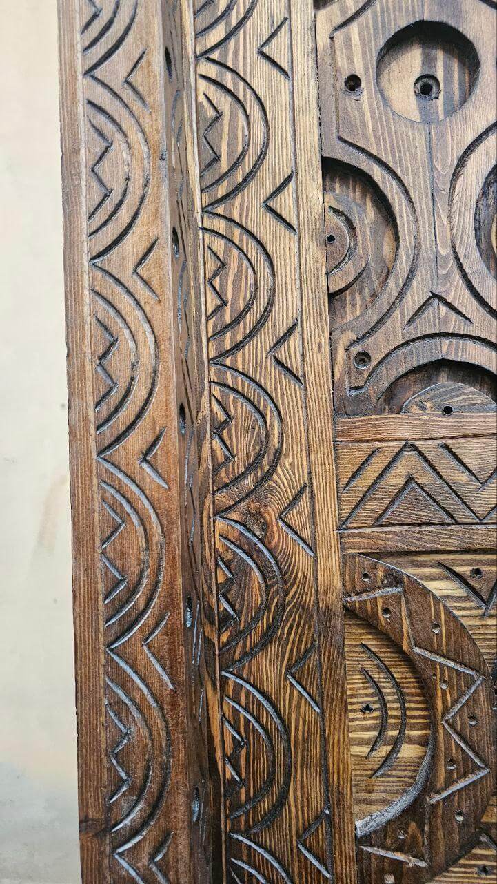Vintage single panel wooden door — close detail of carving