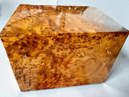 Wooden jewelry box with a burl pattern on a white background
