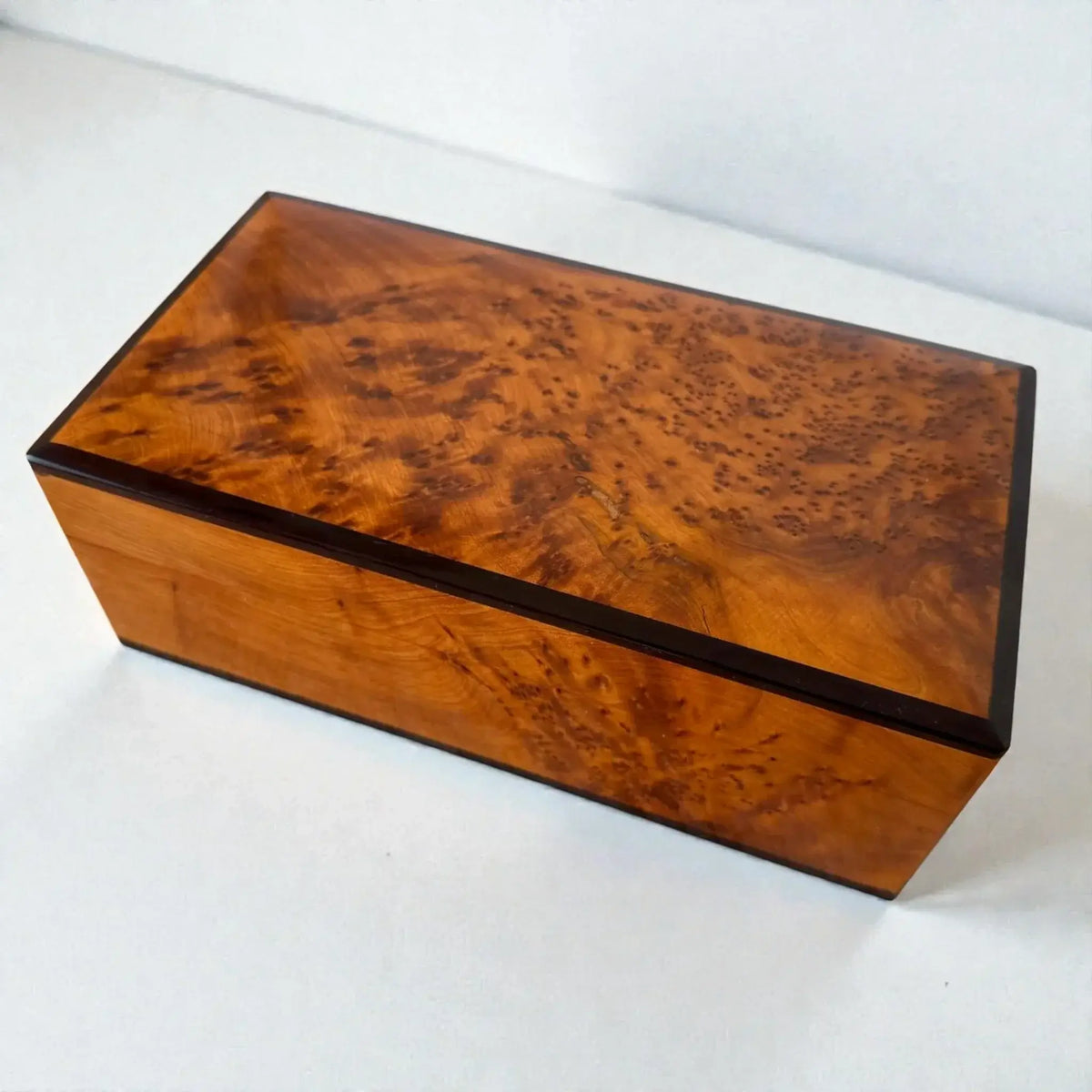 Moroccan Wooden Chest – Handmade Thuya Wood Keepsake Box with unique grain and warm amber tone.
