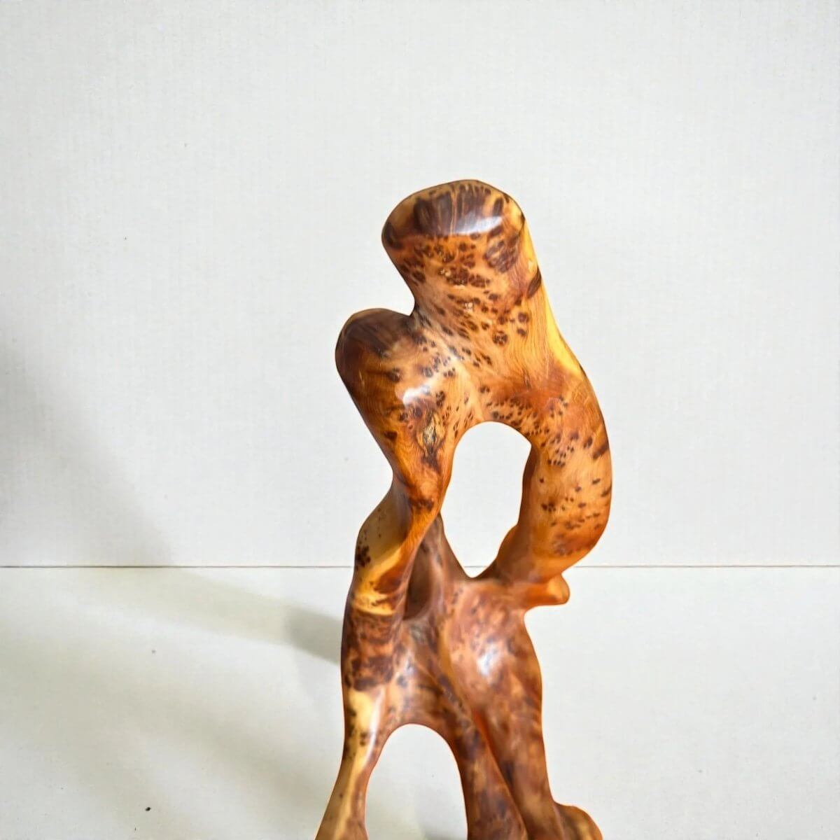 Handmade Thuya wood sculpture with swirling grain detail