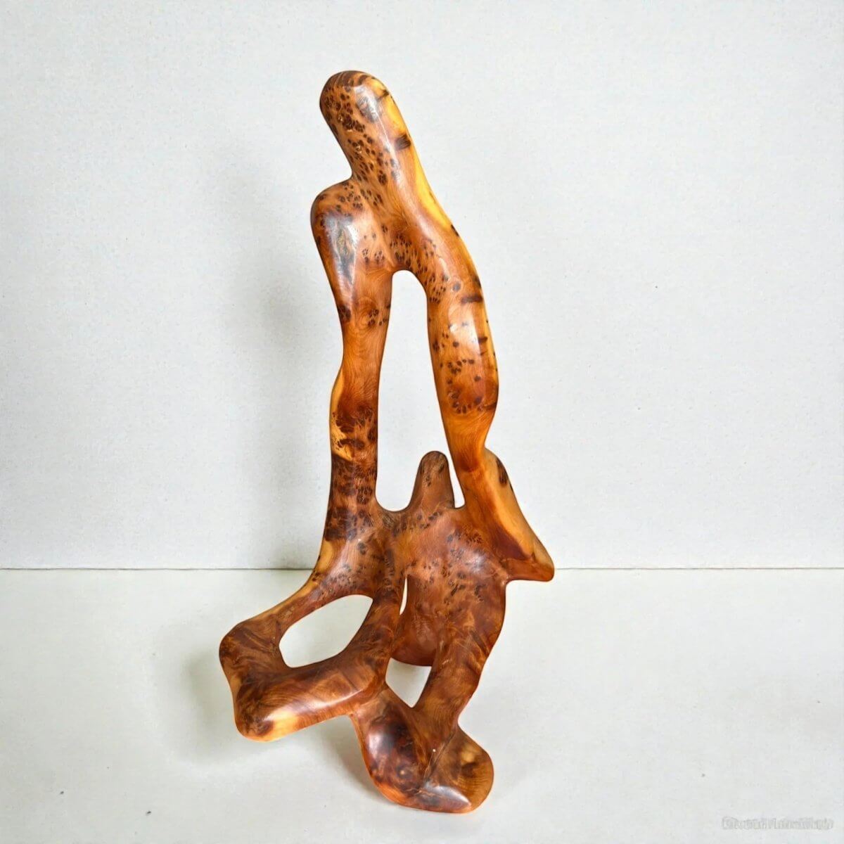 Abstract Thuya wood sculpture with rich golden-brown grain