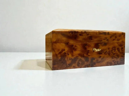 AtlasMuseCrafts handmade Thuya wood jewelry box with swirling grain and gold clasp. Ideal for keepsakes, rings, and watches.