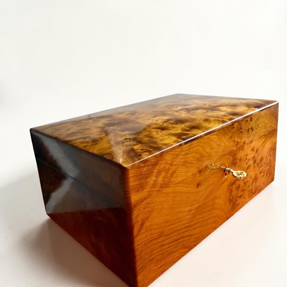 Polished Thuya burl wood box holder with classic lock detail
