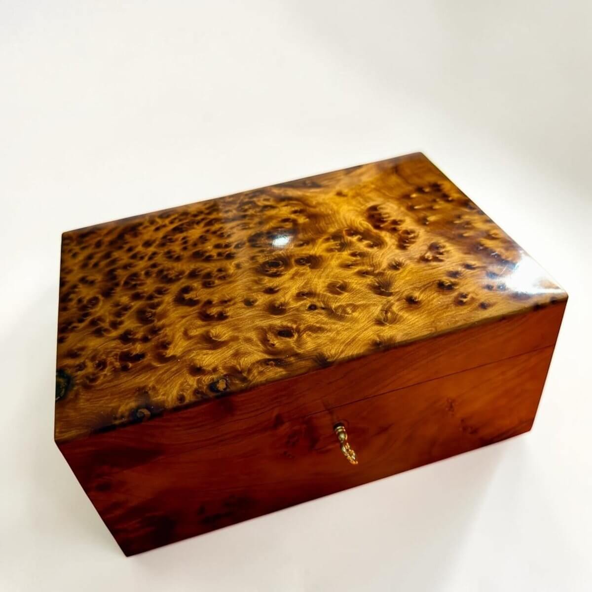 Moroccan Thuya wooden box with key detail and polished burl grain