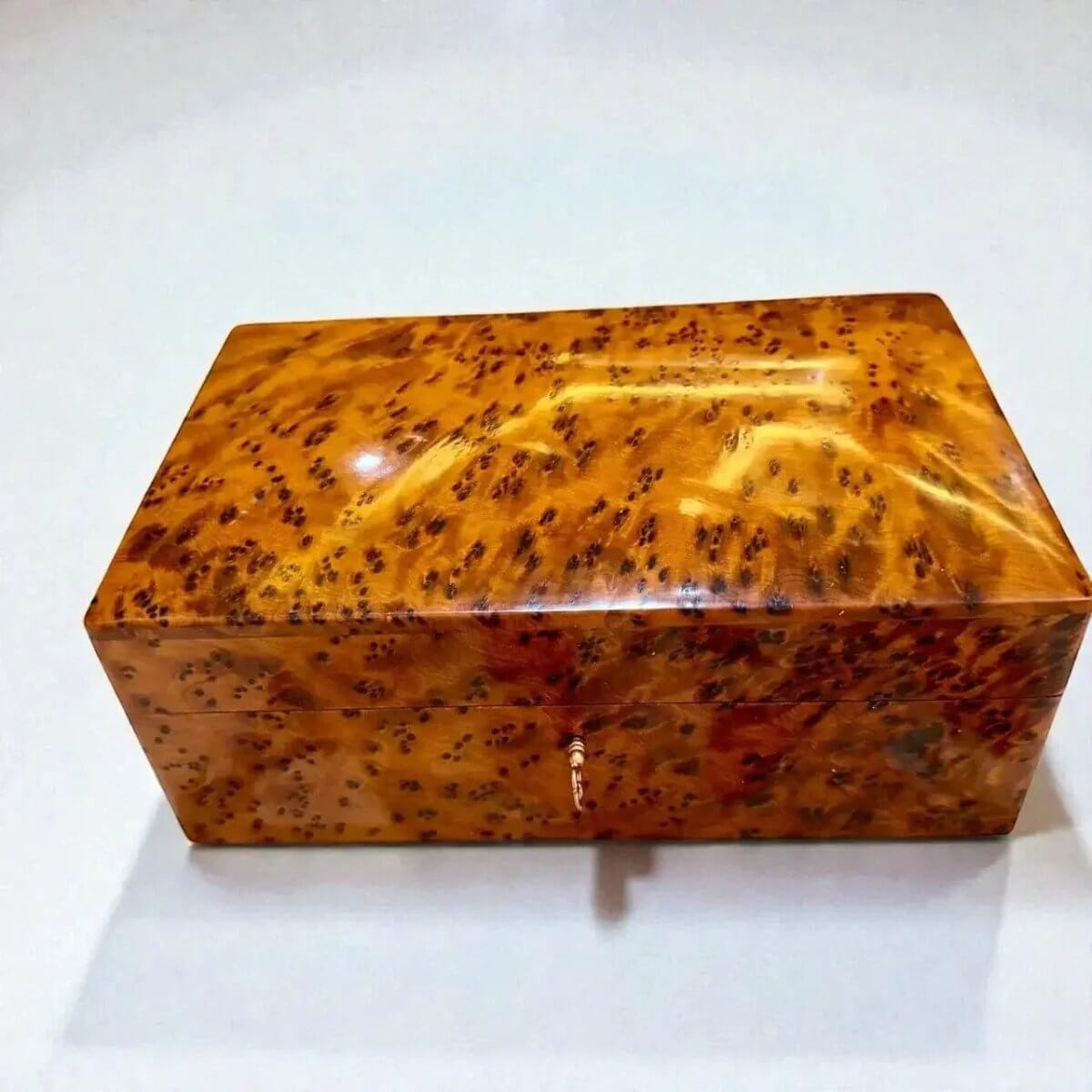Wooden Box with Key – Handmade Moroccan Thuya Jewelry Box, crafted from rich Thuya burl wood with a glossy finish.