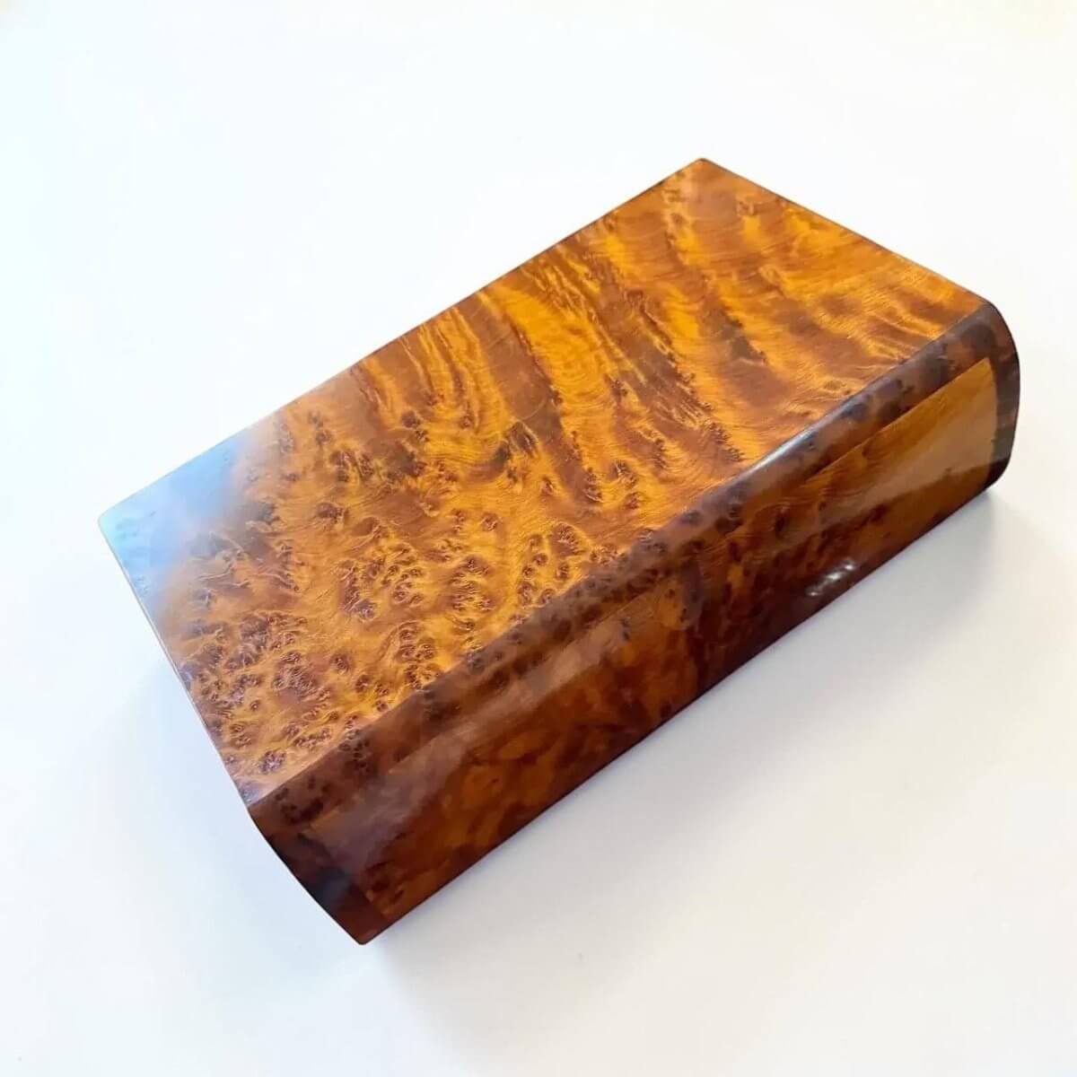 Handmade Moroccan Thuya Storage Box with warm amber tone and distinctive burl grain, perfect for keepsakes.