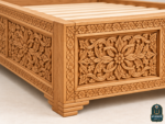 Moroccan carved wood bed frame detail