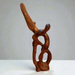 Modern wood sculpture with organic abstract form and natural grain