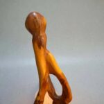 Natural wood shelf sculpture with organic artisan form
