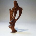 Moroccan hand-carved wood sculpture with artisan surface detail
