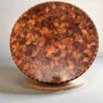 Round solid wood coffee table with geometric wood inlay