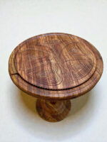 Walnut coffee table with carved top design and warm natural finish