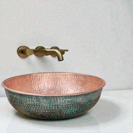 Green Patina Brass Vessel Sink displayed in a stylish bathroom with a round mirror and modern fixtures.