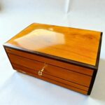 Decorative Wooden Keepsake Box in polished Thuya wood with brass clasp, ideal for jewelry or treasures.