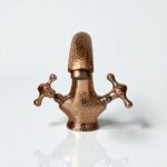 Farmhouse Copper Bathroom Faucet featuring handcrafted design and vintage knobs.