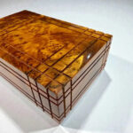 Puzzle Wooden Box with Hidden Compartments crafted from Thuya burl wood, showcasing intricate details and craftsmanship.