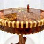 Round wood coffee table with Moroccan Thuya grain and starburst inlay